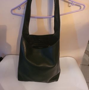 Hobo-like,soft leather;gold metal horsebit clasp closes bag loosely.